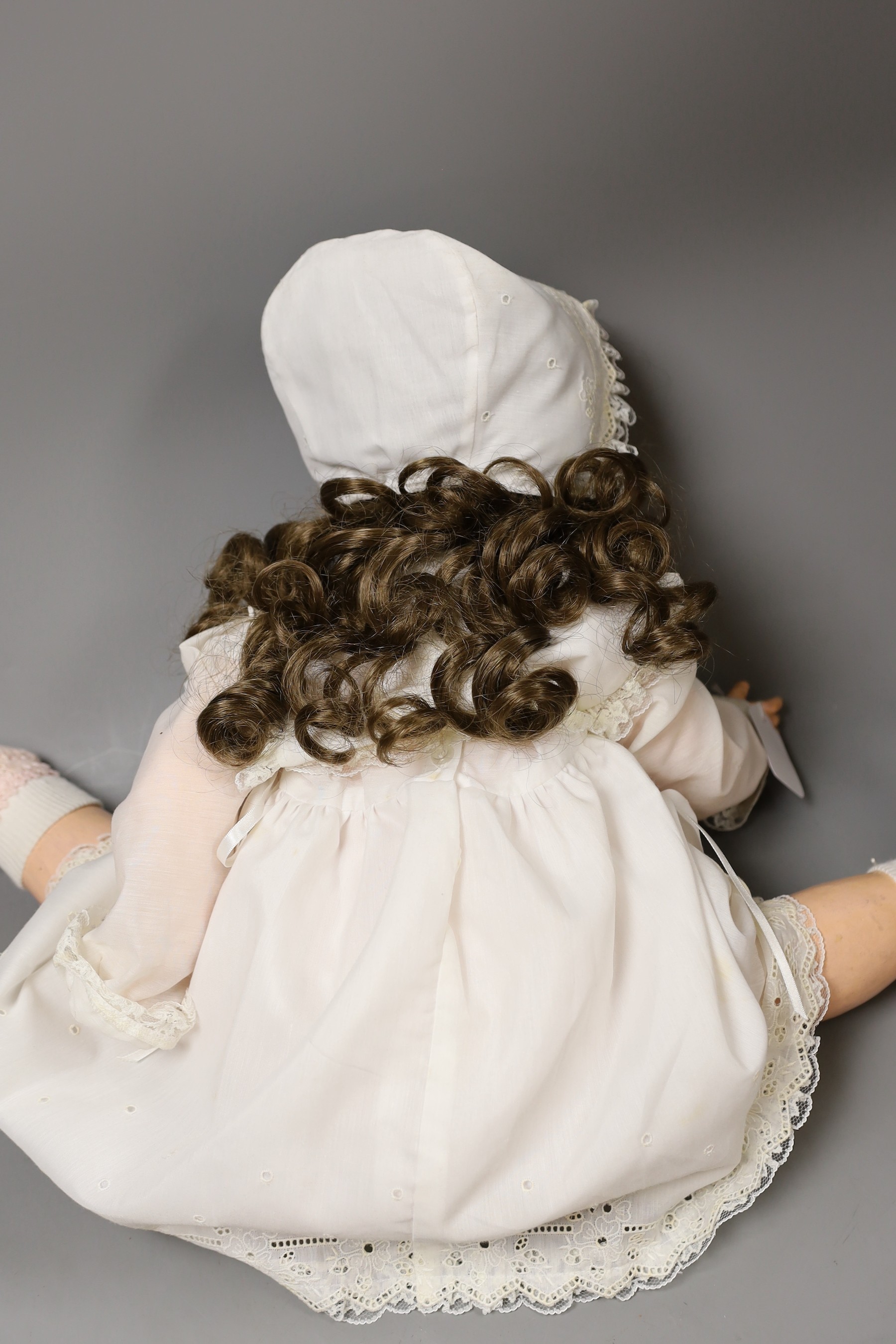 A Heubach Koppelsdorf bisque headed, open mouthed doll, 66cms long